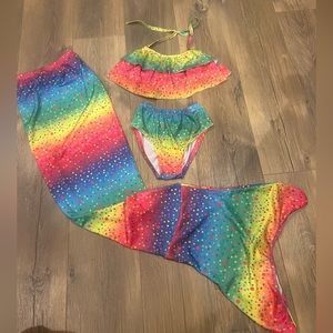 Girls size 150, aka 10/12, swimsuit with mermaid tail cover. Super cute!